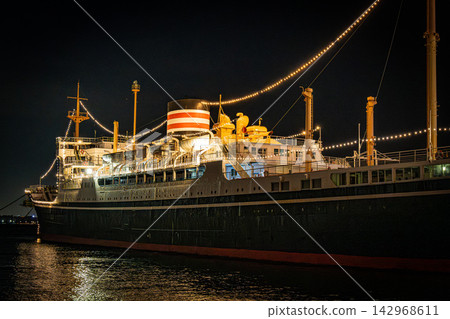 The Ocean Liner Hikawa Maru shines brightly in the nostalgic night view of Yokohama. The Ocean Liner Hikawa Maru shines brightly in the nostalgic night view of Yokohama. 142968611