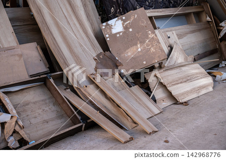 Group of wooden furniture destroyed after Kok river flooded Chiang Rai province of Thailand. 142968776