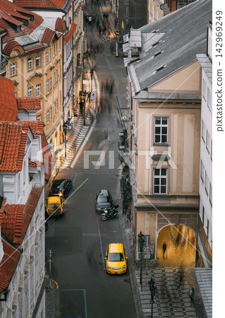 Motion light trails on a curved Prague alley at dusk Motion light trails on a curved Prague alley at dusk 142969249