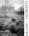 German Wehrmacht Infantry Soldiers In World War II Hidden Sitting With Rifles Weapons In An Ambush In Trench German Wehrmacht Infantry Soldiers In World War II Hidden Sitting With Rifles Weapons In An Ambush In Trench 142969372