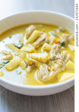 Creamy chicken potato soup with vegetables in white bowl Creamy chicken potato soup with vegetables in white bowl 142971684