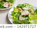 Chicken salad with romaine lettuce, crouton, and cheese 142971727