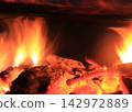 Burning fire logs 142972889