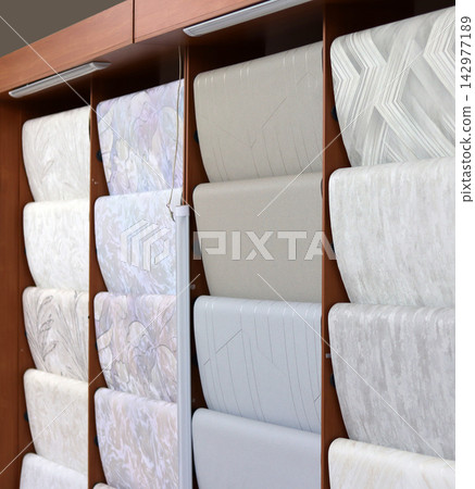 Samples of different color wallpapers in the store. Close-up. Samples of different color wallpapers in the store. Close-up. 142977189