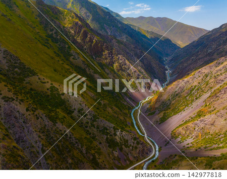 Aerial View of Mountain Valley with River and Road Aerial View of Mountain Valley with River and Road 142977818