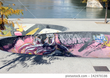 Graffiti Skatepark Bowl Beside Urban River Waterfront Graffiti Skatepark Bowl Beside Urban River Waterfront 142978186