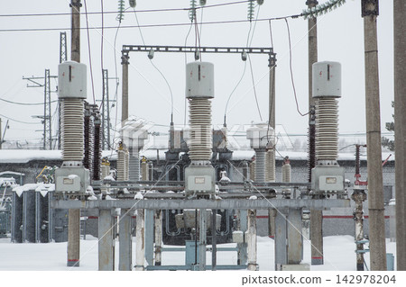 Electrical Substation Equipment in Snowy Winter Industrial Scene 142978204