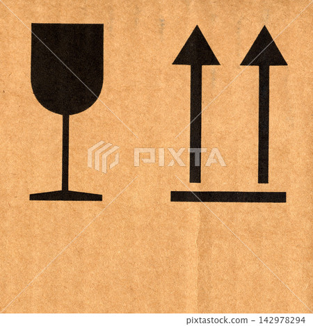 Fragile and This Side Up Packaging Symbols on Cardboard Fragile and This Side Up Packaging Symbols on Cardboard 142978294