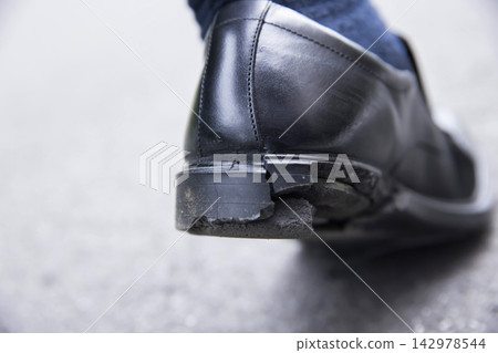 Deteriorated and broken shoe soles Deteriorated and broken shoe soles 142978544