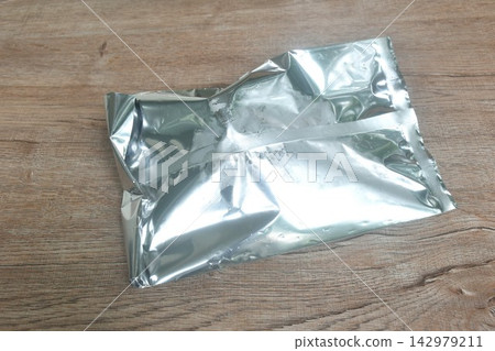 aluminum package foil for maintain temperature of ice cream or snack arranging on table aluminum package foil for maintain temperature of ice cream or snack arranging on table 142979211
