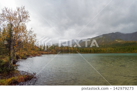 Moody landscape of a rainy lake in Arctic region Moody landscape of a rainy lake in Arctic region 142979273