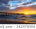 Glenelg Beach Jetty with people silhouettes at warm summer sunset, Adelaide, South Australia 142979304