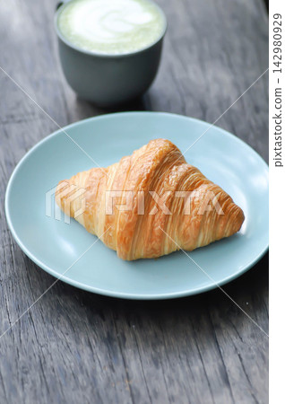 croissant , French croissant or French bread and matcha green tea or matcha green tea latte croissant , French croissant or French bread and matcha green tea or matcha green tea latte 142980929