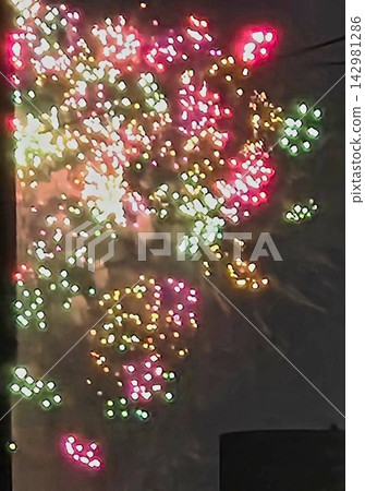 Fireworks display in the night sky Fireworks display in the night sky 142981286