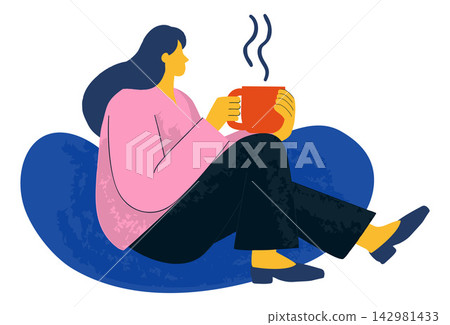 Woman Relaxing with Hot Drink on Beanbag Woman Relaxing with Hot Drink on Beanbag 142981433