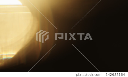 real lens flare from back sunlight over dark background for overlay real lens flare from back sunlight over dark background for overlay 142982164