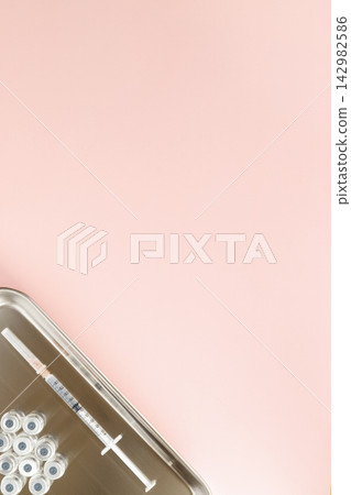 Preparation for subcutaneous injection: vials and 1ml syringes arranged on a metal tray. Preparation for subcutaneous injection: vials and 1ml syringes arranged on a metal tray. 142982586