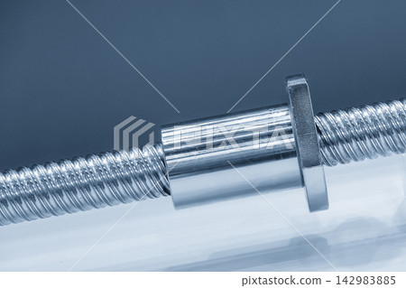 Close-up of a ball screw set assembly with a bush in a blue tone scene Close-up of a ball screw set assembly with a bush in a blue tone scene 142983885