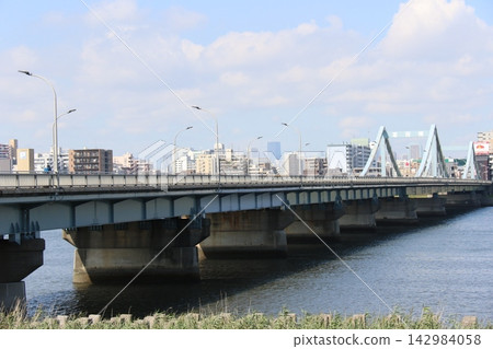 A distant view of Kasai Bridge over the Arakawa River in Tokyo. A distant view of Kasai Bridge over the Arakawa River in Tokyo. 142984058