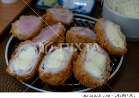 Sous vide pork katsu. Tonkatsu including fillet and cheese katsu. Fried Pork serve on plate in restaurant Sous vide pork katsu. Tonkatsu including fillet and cheese katsu. Fried Pork serve on plate in restaurant 142984305