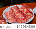 Raw Sirloin Hanwoo Beef, marbled Korean Style Meat prepared on the plate 142984309