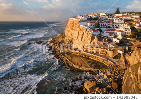 Scenic sunset view of Azenhas do Mar village along the Atlantic coast. Portugal Scenic sunset view of Azenhas do Mar village along the Atlantic coast. Portugal 142985045