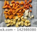 Fresh Chopped Vegetables for Roasting, Pumpkin, Carrot, Potato, Onion and Garlic 142986080