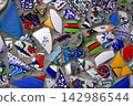 Background of a decorative mosaic made from shards of colored ceramic tableware. 142986544