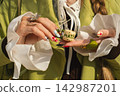 Artistic manicure and stylish accessories highlight modern fashion 142987201