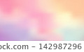 Blurred peach and pink gradient background with soft orange grain texture. 142987296
