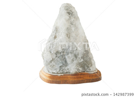Salt lamp with wooden base solated on a white background. Home decor. Air purifier. Handcrafted. Salt lamp with wooden base solated on a white background. Home decor. Air purifier. Handcrafted. 142987399