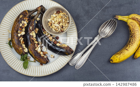 Chocolate Stuffed Grilled Bananas with Mixed Nuts and Mint Chocolate Stuffed Grilled Bananas with Mixed Nuts and Mint 142987486