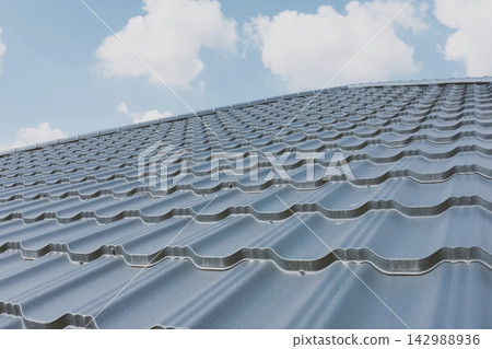 Corrugated metal roof and metal roofing. Modern roof made of met 142988936