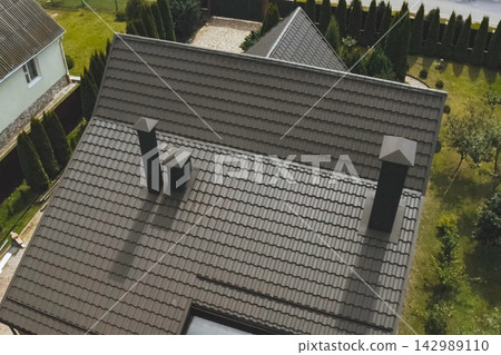 Corrugated metal roof and metal roofing. Modern roof made of metal. Corrugated metal roof and metal roofing. Modern roof made of metal. 142989110