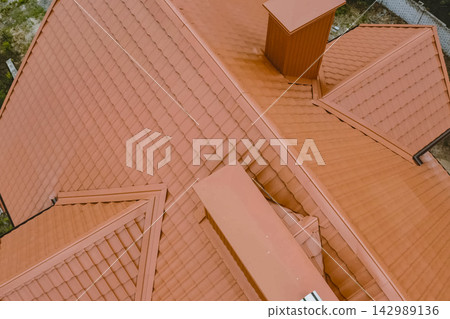 Corrugated metal roof and metal roofing. Modern roof made of metal. Corrugated metal roof and metal roofing. Modern roof made of metal. 142989136