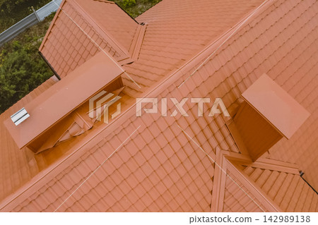 Corrugated metal roof and metal roofing. Modern roof made of metal. 142989138
