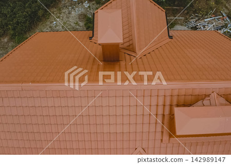 Corrugated metal roof and metal roofing. Modern roof made of metal. 142989147