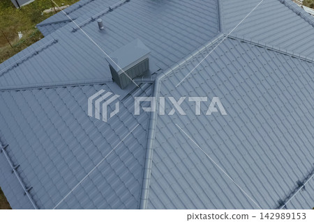 Corrugated metal roof and metal roofing. Modern roof made of metal. Corrugated metal roof and metal roofing. Modern roof made of metal. 142989153