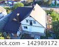 Corrugated metal roof and metal roofing. Modern roof made of metal. 142989172
