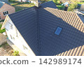 Corrugated metal roof and metal roofing. Modern roof made of metal. 142989174