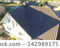Corrugated metal roof and metal roofing. Modern roof made of metal. 142989175