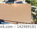 Corrugated metal roof and metal roofing. Modern roof made of metal. 142989181