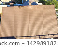 Corrugated metal roof and metal roofing. Modern roof made of metal. 142989182