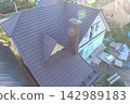 Corrugated metal roof and metal roofing. Modern roof made of metal. 142989183