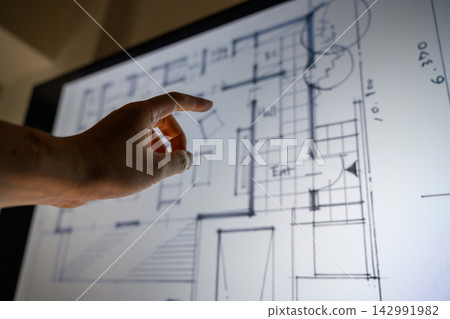 Architect pointing to digital drawings Architect pointing to digital drawings 142991982