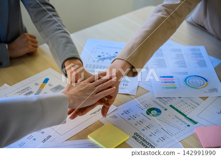 Handshakes and documents at business meetings Handshakes and documents at business meetings 142991990