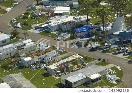 Badly damaged mobile homes after hurricane Ian in Florida residential area. Consequences of natural disaster Badly damaged mobile homes after hurricane Ian in Florida residential area. Consequences of natural disaster 142992386