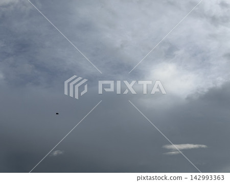 The dark sky on a cloudy day / The sky 142993363