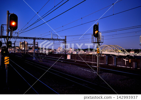 Sunrise over the Tamagawa River from the platform of Izumi-Tamagawa Station on the Odakyu Line. Sunrise over the Tamagawa River from the platform of Izumi-Tamagawa Station on the Odakyu Line. 142993937