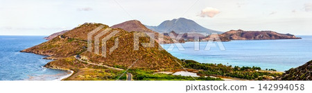 Panoramic scenic view of the Southeast Peninsula and Nevis Peak from Timothy Hill Overlook in Saint Kitts and Nevis. Panoramic scenic view of the Southeast Peninsula and Nevis Peak from Timothy Hill Overlook in Saint Kitts and Nevis. 142994058